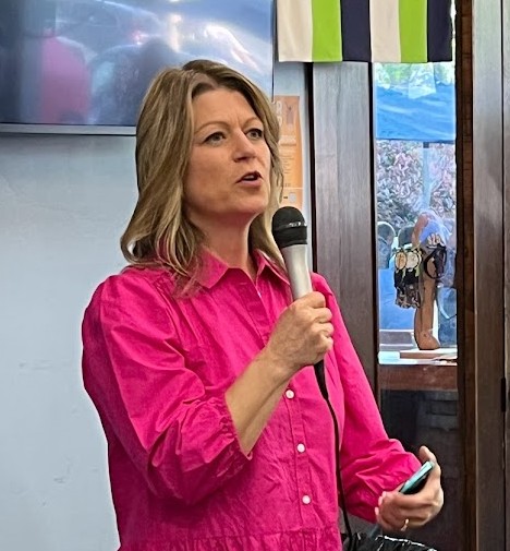 Angela speaking at an event